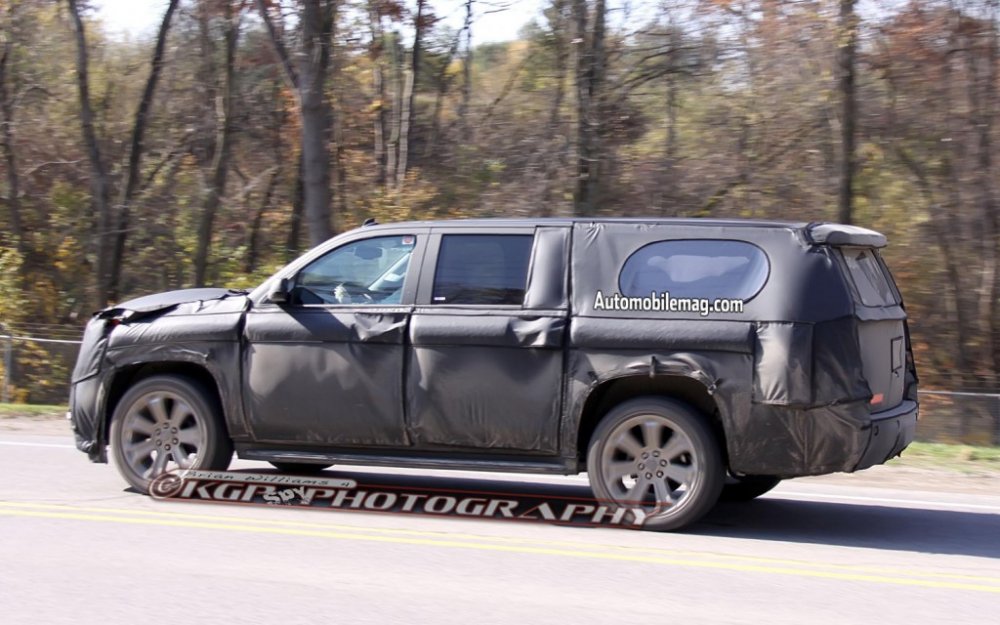Cadillac-Escalade-left-side-spy-shot-2-1024x640.thumb.jpg.31f03293ff51c8477e08d05186c91ade.jpg